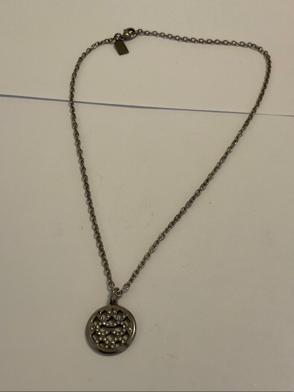 Coach sterling silver crystal pendant necklace